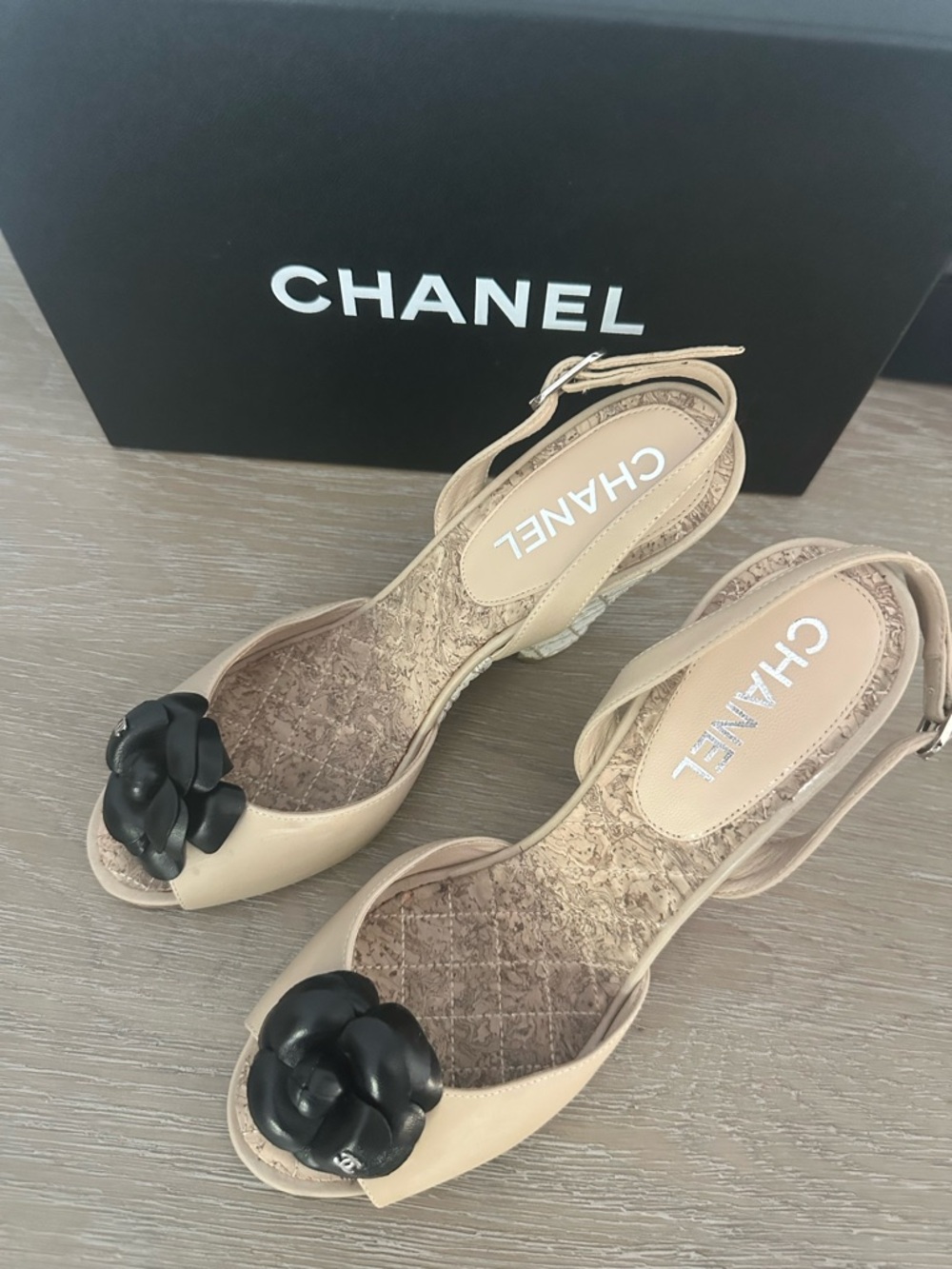 CHANEL Beige Slingback Sandals with Black Camellia Accent